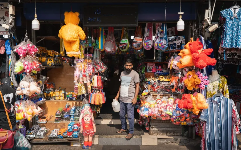 A toy shop in a busy bazaar, full of colourful toys